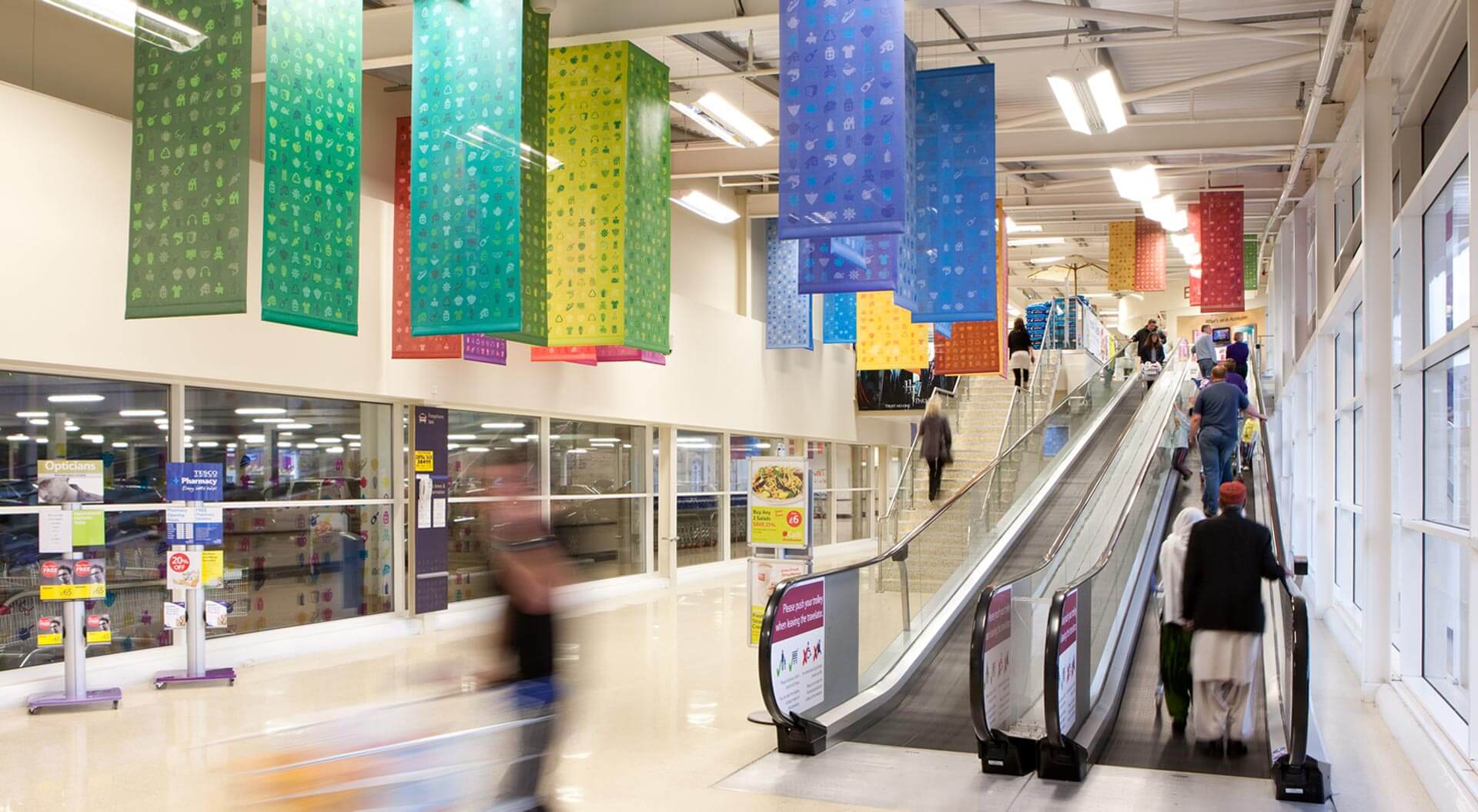 Tesco hypermarket escalator entrance branding