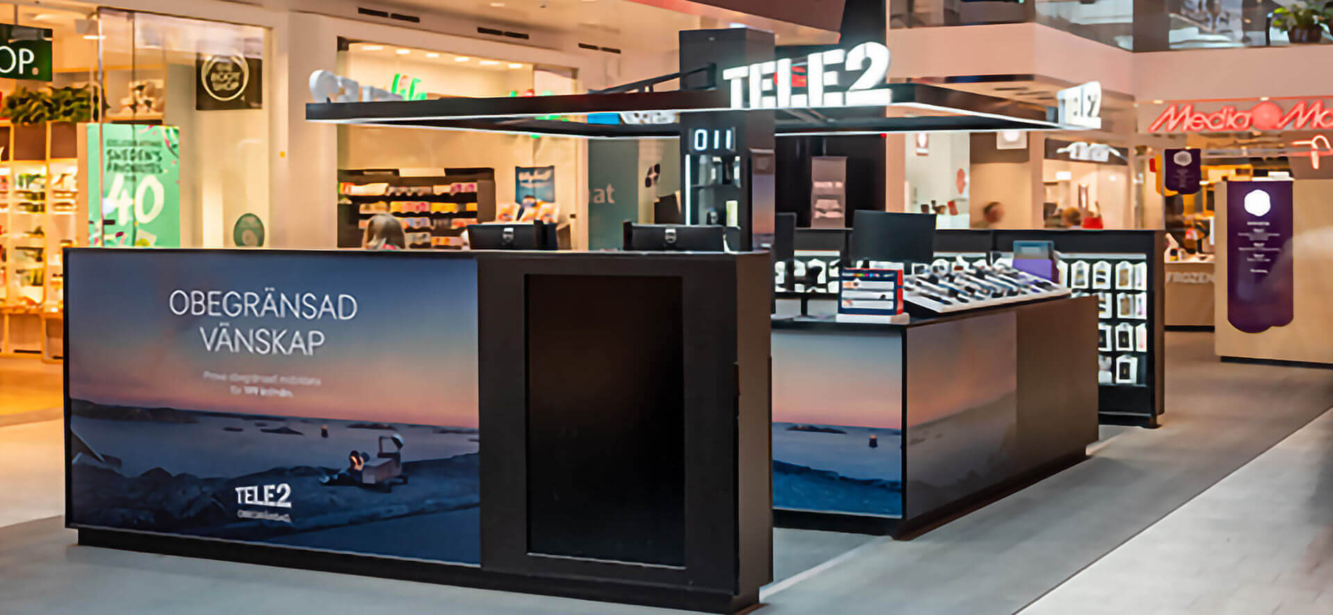 Tele2 store interior design – mall kiosk consultation point in-store accessories merchandising systems display
