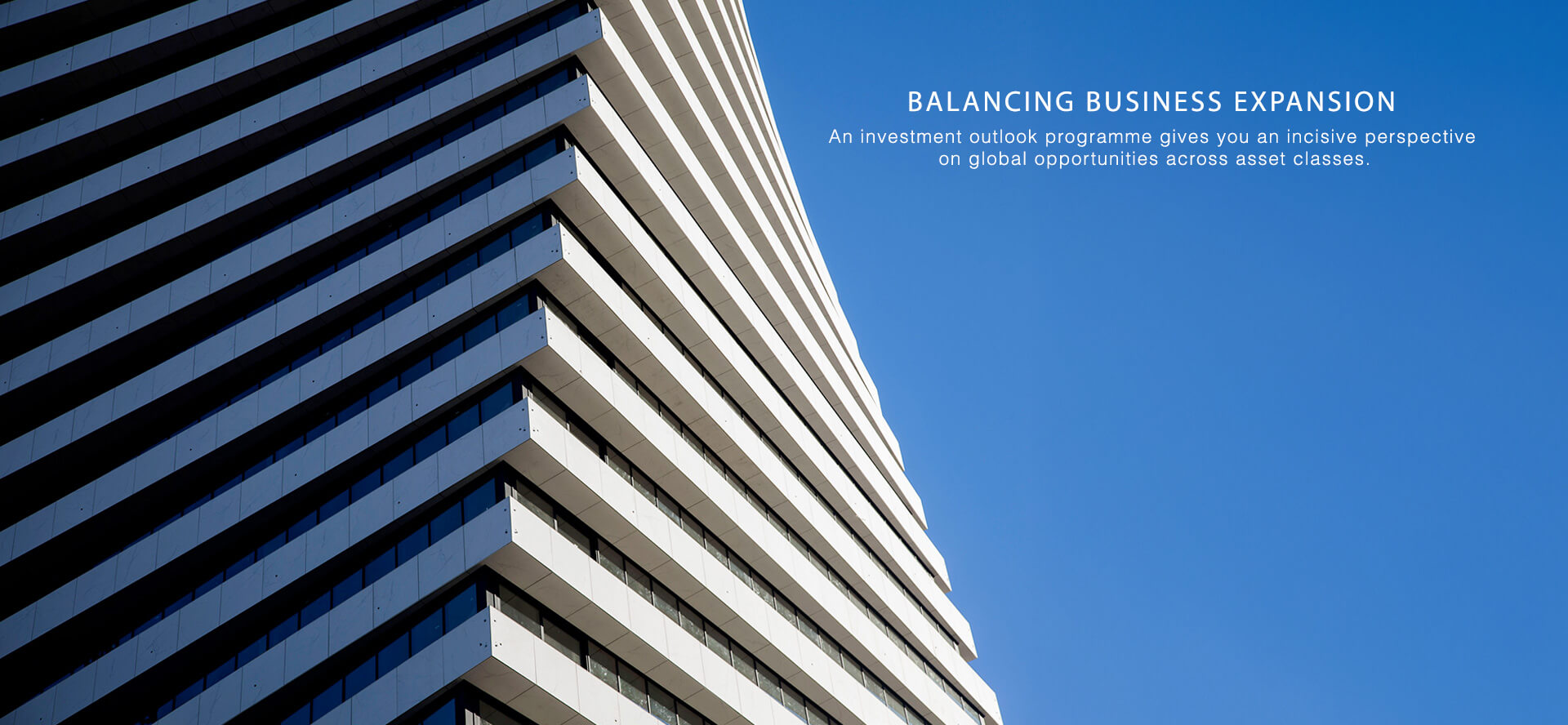 Marketing Services - BALANCING BUSINESS EXPANSION - An investment outlook programme gives you an incisive perspective on global opportunities across asset classes. Contemporary commercial office building.