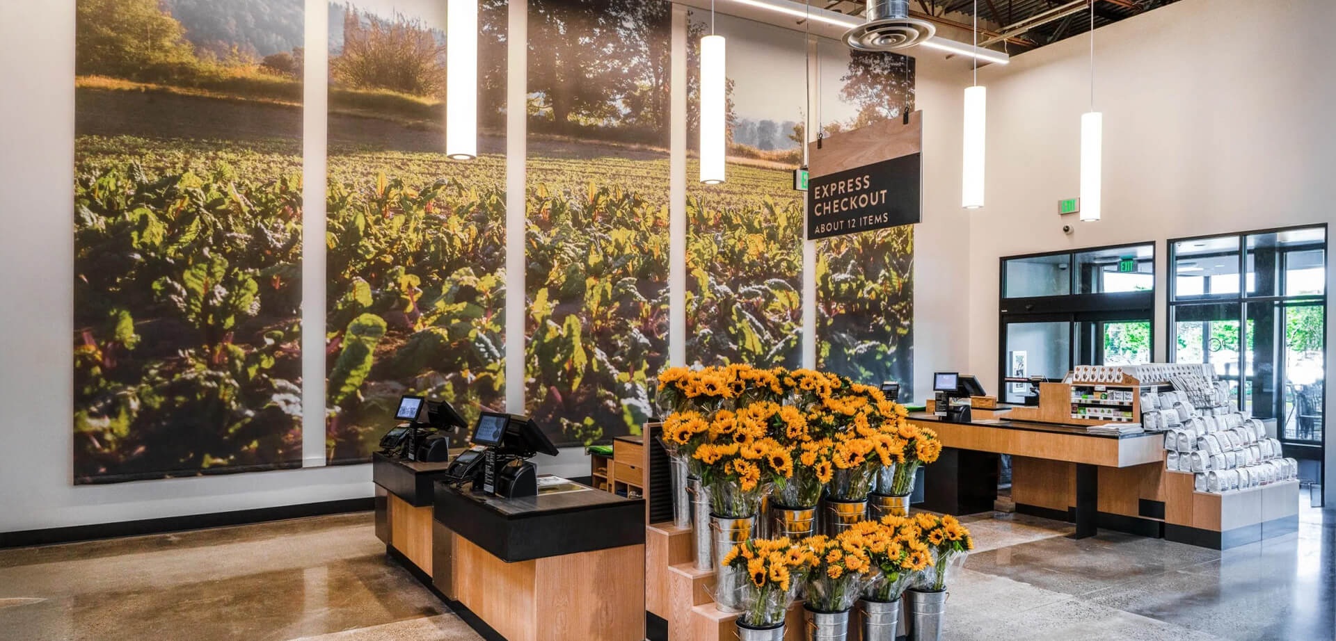 PCC Community Markets is a food cooperative express checkouts.  The store offers organic and responsibly sourced products, including meats, produce, and various grocery items. 