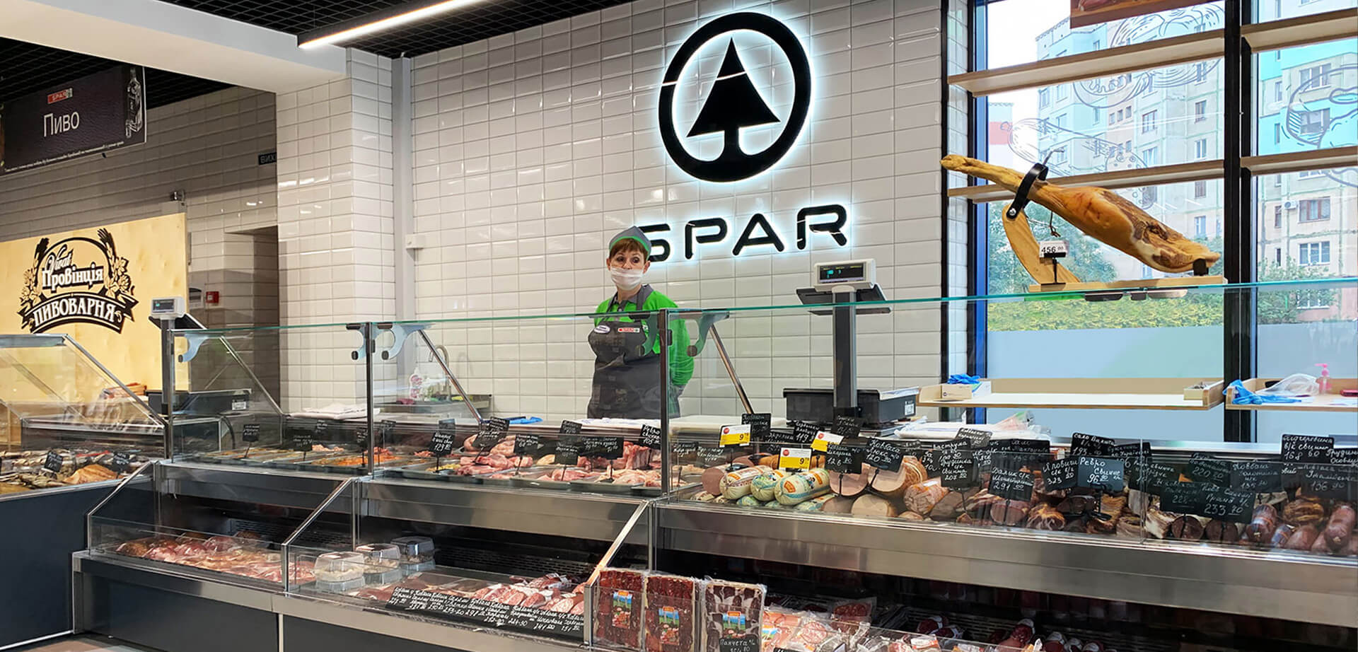 This image is of the interior of a SPAR supermarket in Poltava, Ukraine.  SPAR is an international retail chain operating in neighborhoods in urban and rural areas. 
