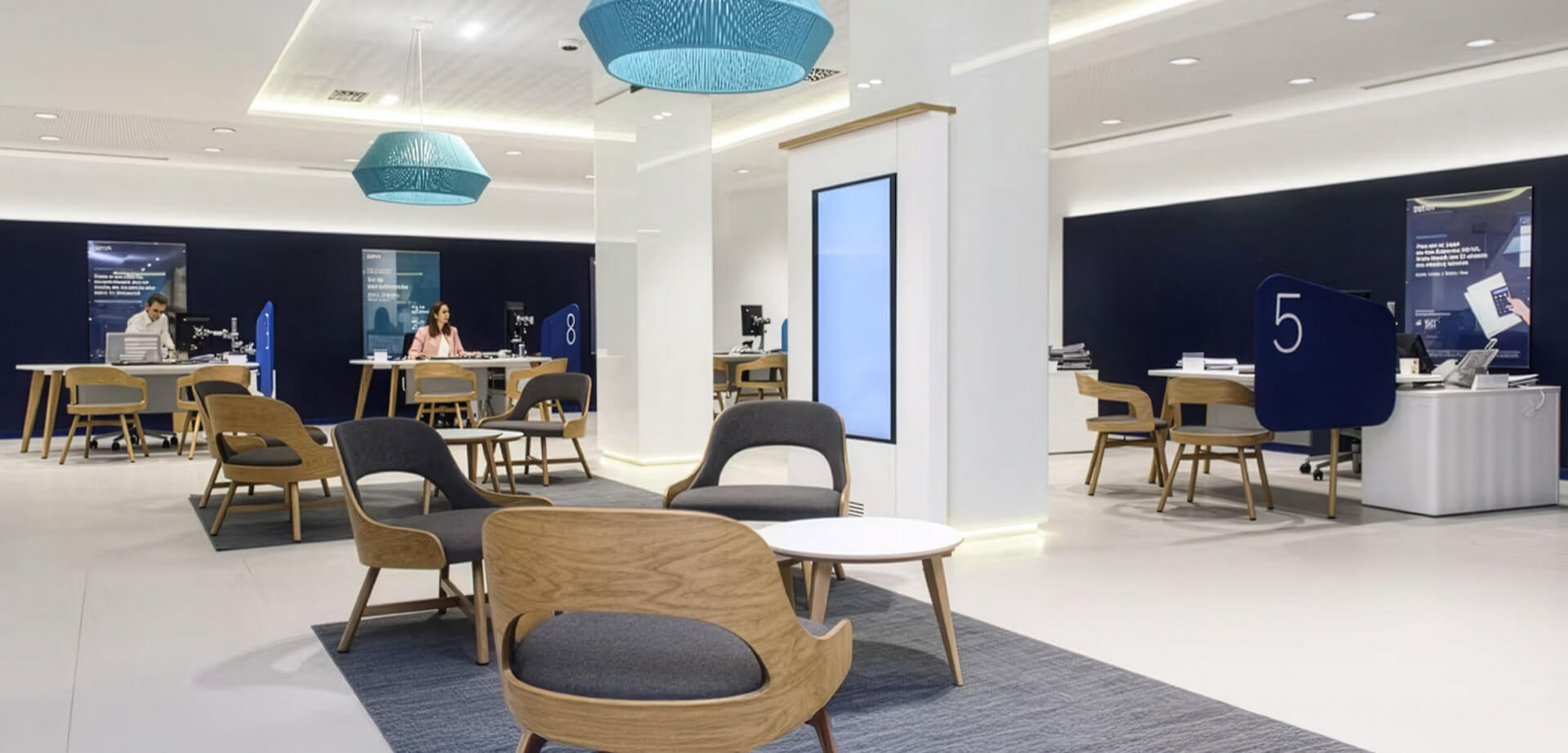 BBVA bank branch, designed as part of their "Blue Branch" concept. This design approach focuses on creating a modern, open, and comfortable customer experience. 