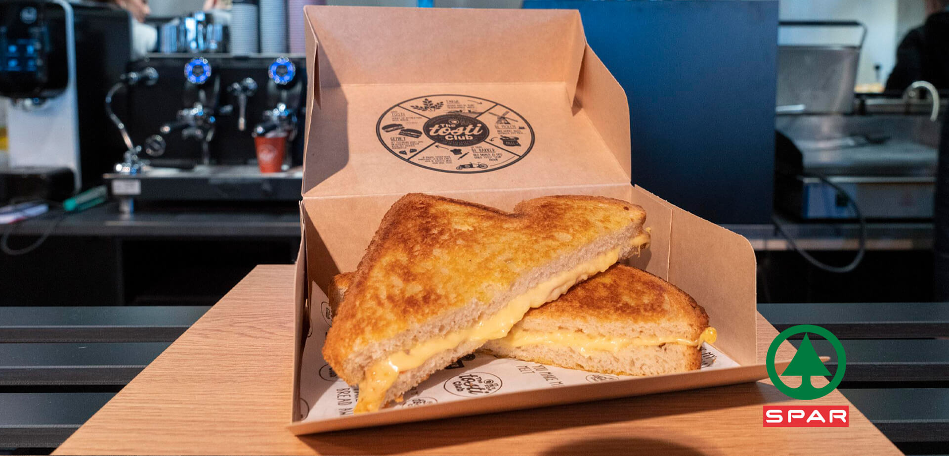 Spar melted cheese sandwich served in a branded takeaway box from "The Tosti Club".