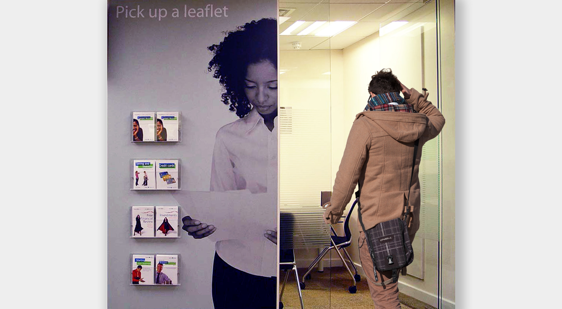 A modern Lloyds office featuring a large wall display prompting visitors to pick up leaflets about financial services, such as saving and credit cards.