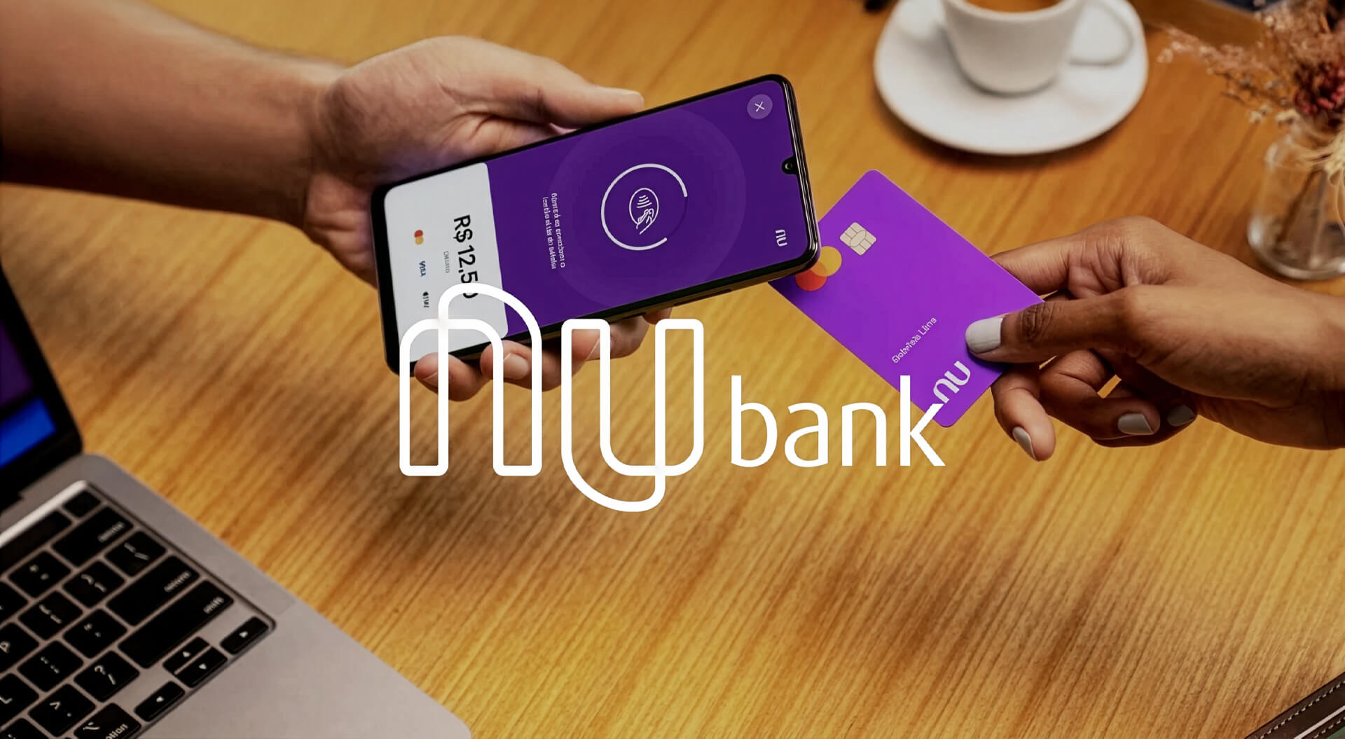 The image features a person making a contactless payment using a Nubank credit card with their smartphone. 
