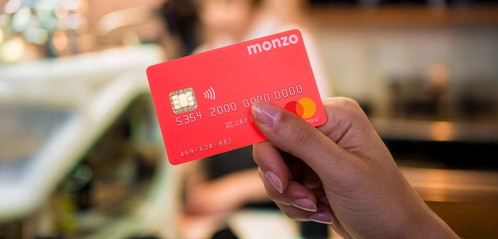 The item shown is a Monzo debit card, a product from the UK-based digital challenger bank, Monzo. 