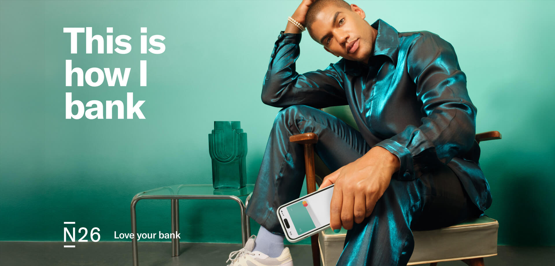 N26 is a European digital bank that offers online banking services and mobile apps for managing finances.  The advertisement highlights a modern, personal approach to banking, featuring the tagline "This is how I bank". 