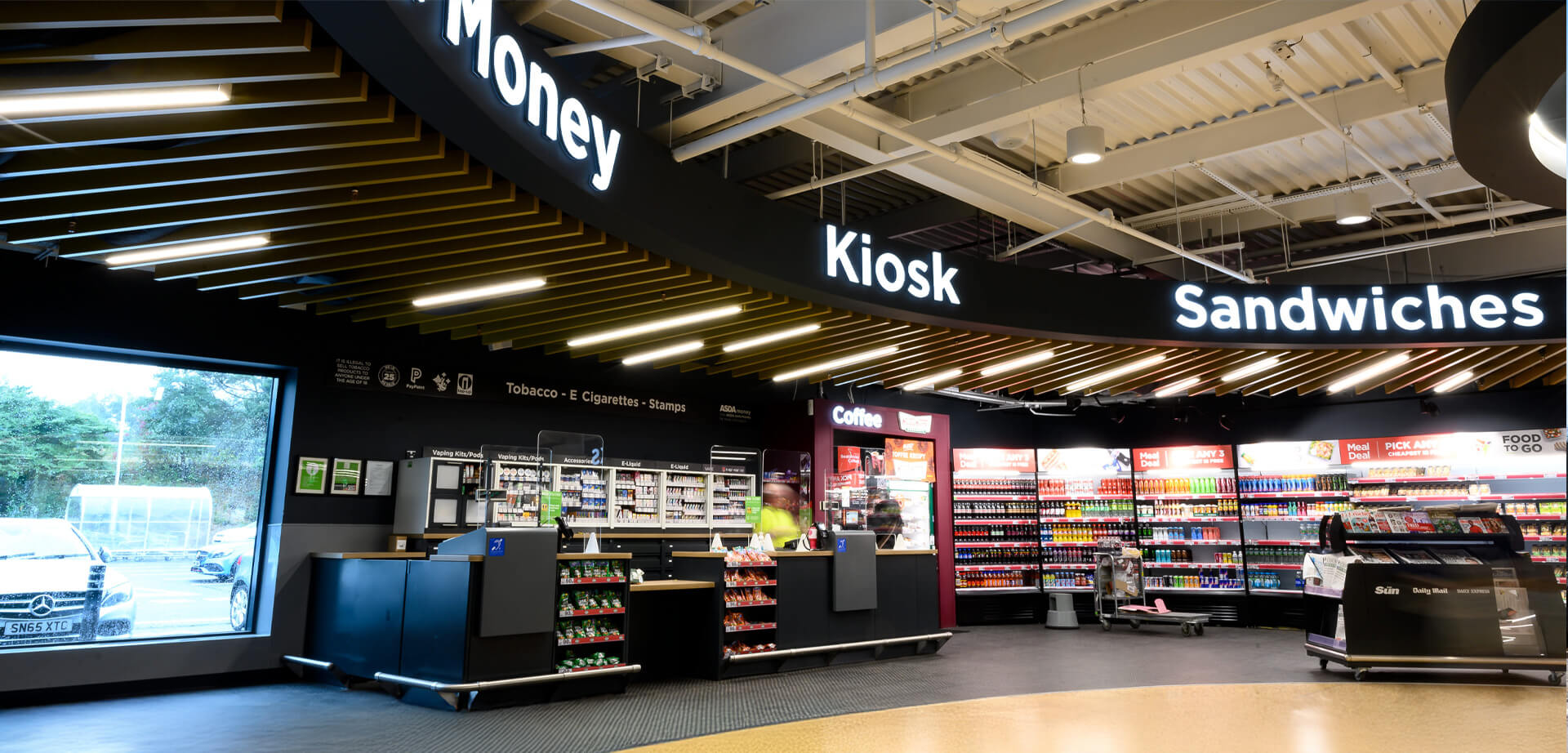 Asda convenience store, branded as "Asda On the Move" or a similar format found on forecourts.