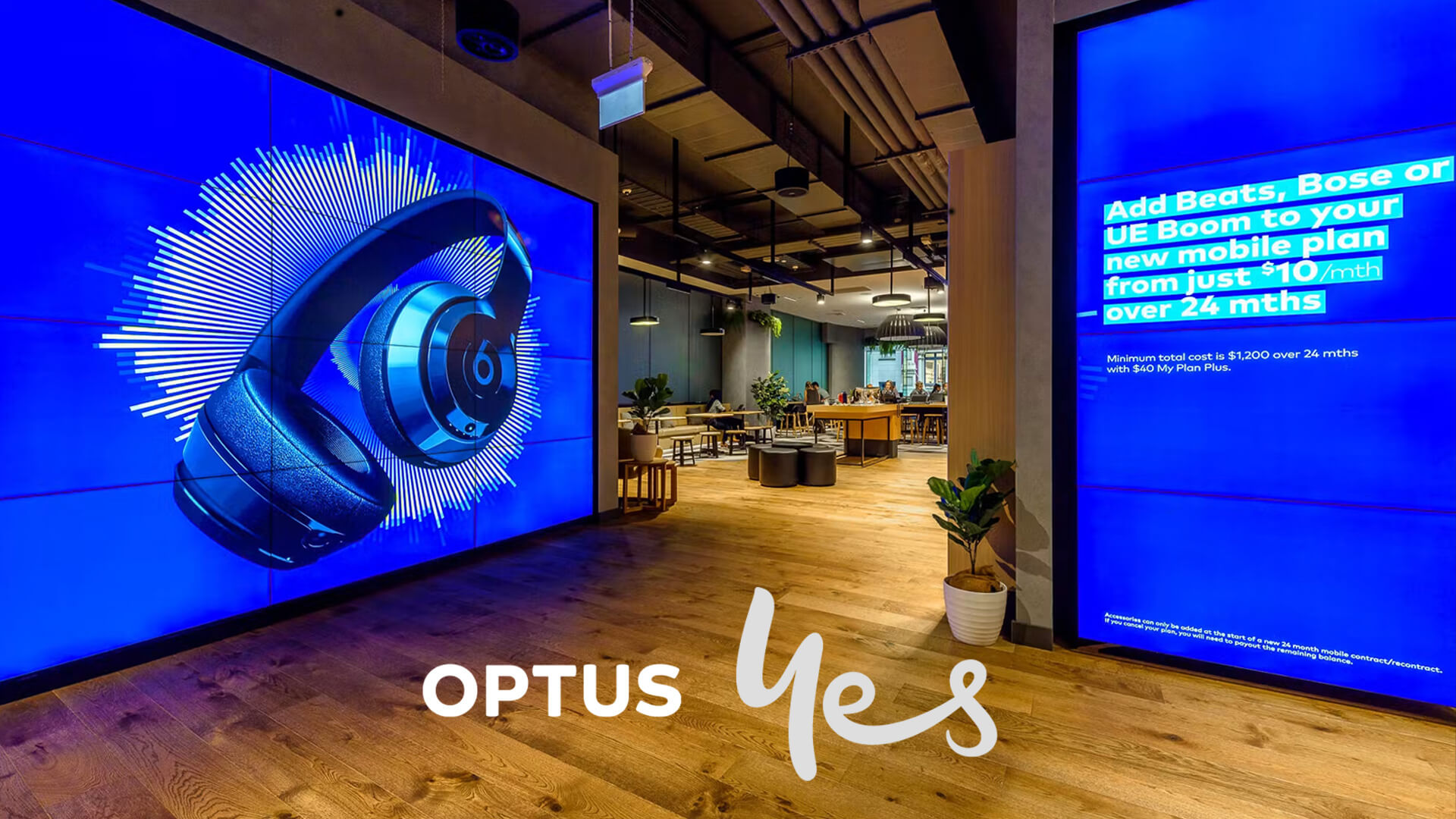 The selected region features a large-scale promotional digital display inside a flagship retail store showcasing Beats by Dr. Dre over-ear headphones.