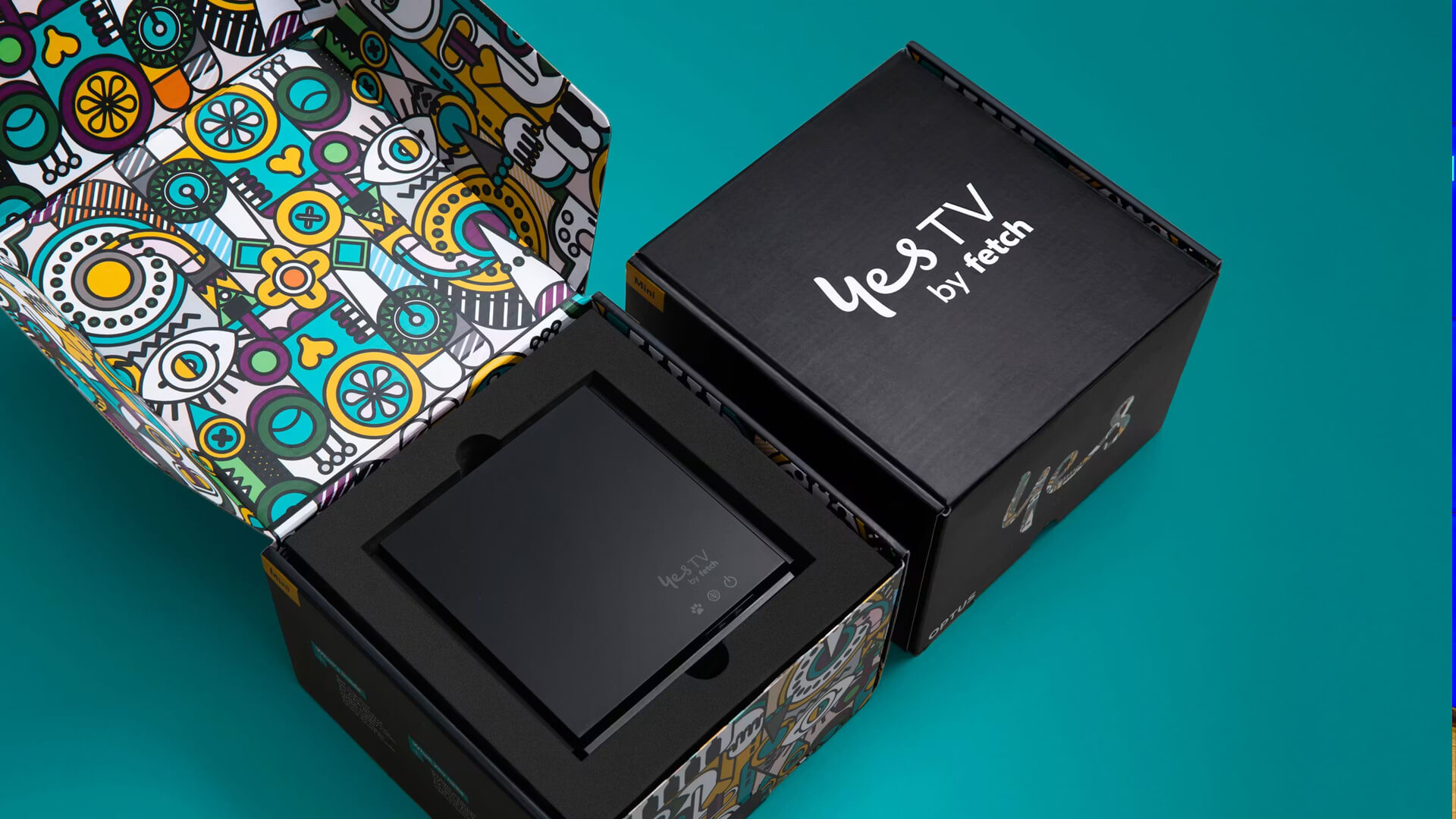 Optus "Yes TV by Fetch" set-top box packaged with branded, colourful interior artwork.The system includes a compact black streaming device and a black box marked with the "Yes TV by Fetch" logo.