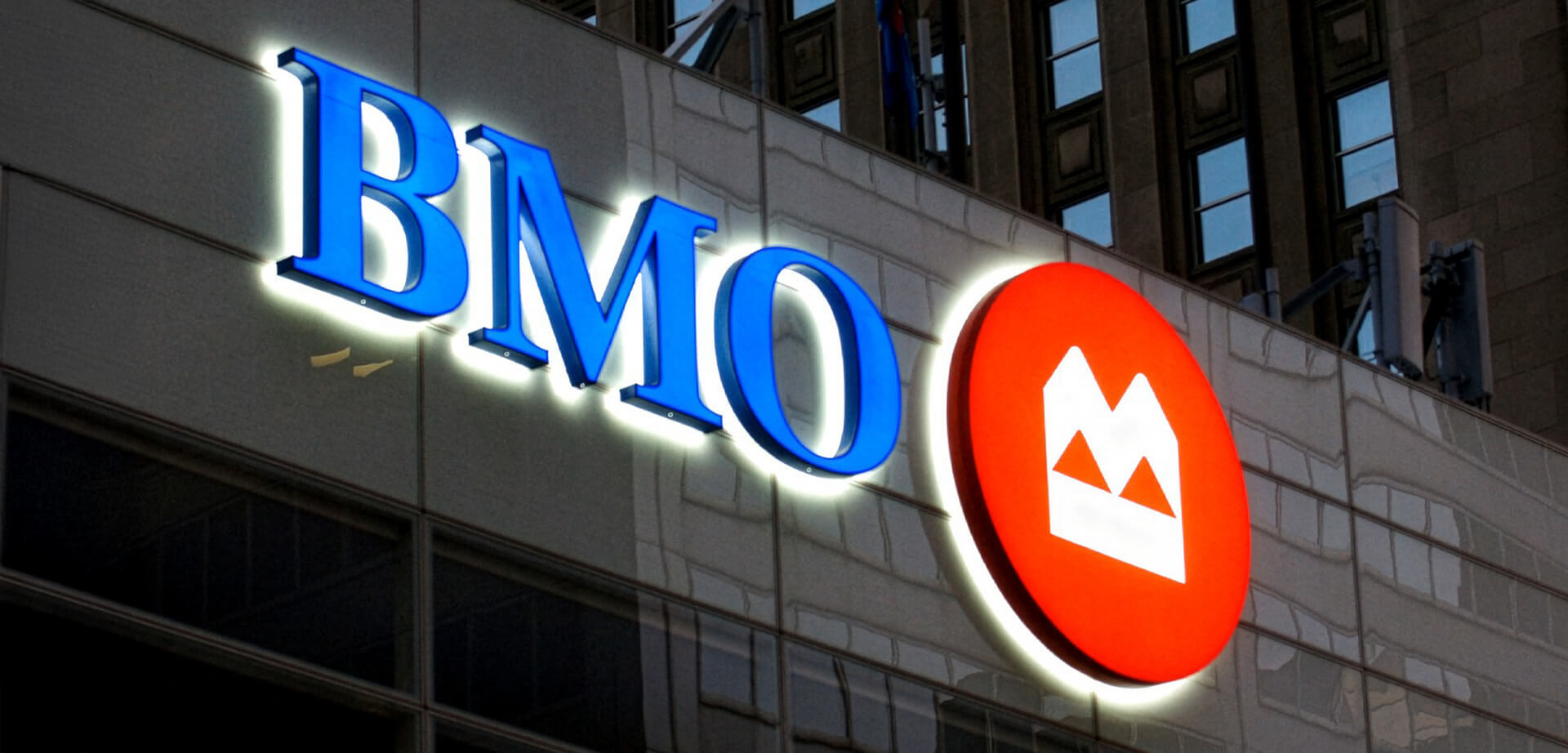 The image features the highly recognizable corporate sign of BMO (Bank of Montreal), a major multinational financial services provider.