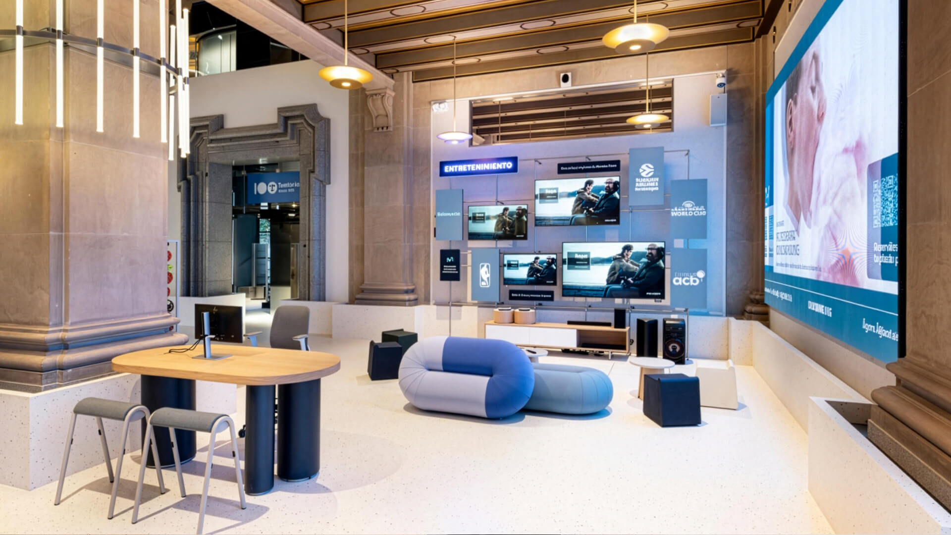 This image features the Espacio Movistar flagship store at Gran Vía 28 in Madrid. Designed by Studio Banana to celebrate Telefónica’s centenary, this historic, tech-forward retail space combines entertainment, digital products, and energy services.