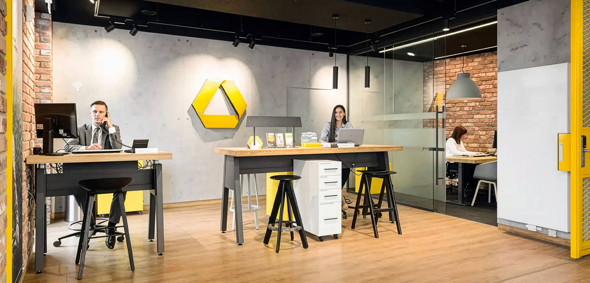 A Commerzbank City-Filiale, a branch design concept. Design Philosophy: The space shifts away from traditional bank counters to resemble a friendly retail store or modern cafe, promoting a more personal and welcoming customer experience.