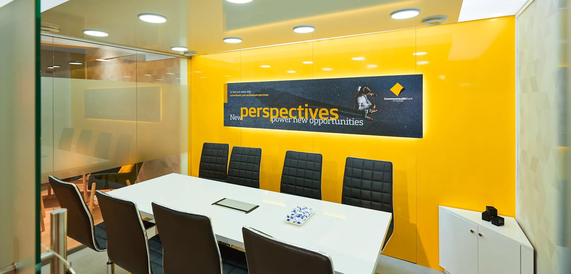 A modern corporate meeting room, specifically an office space for the Commonwealth Bank of Australia.