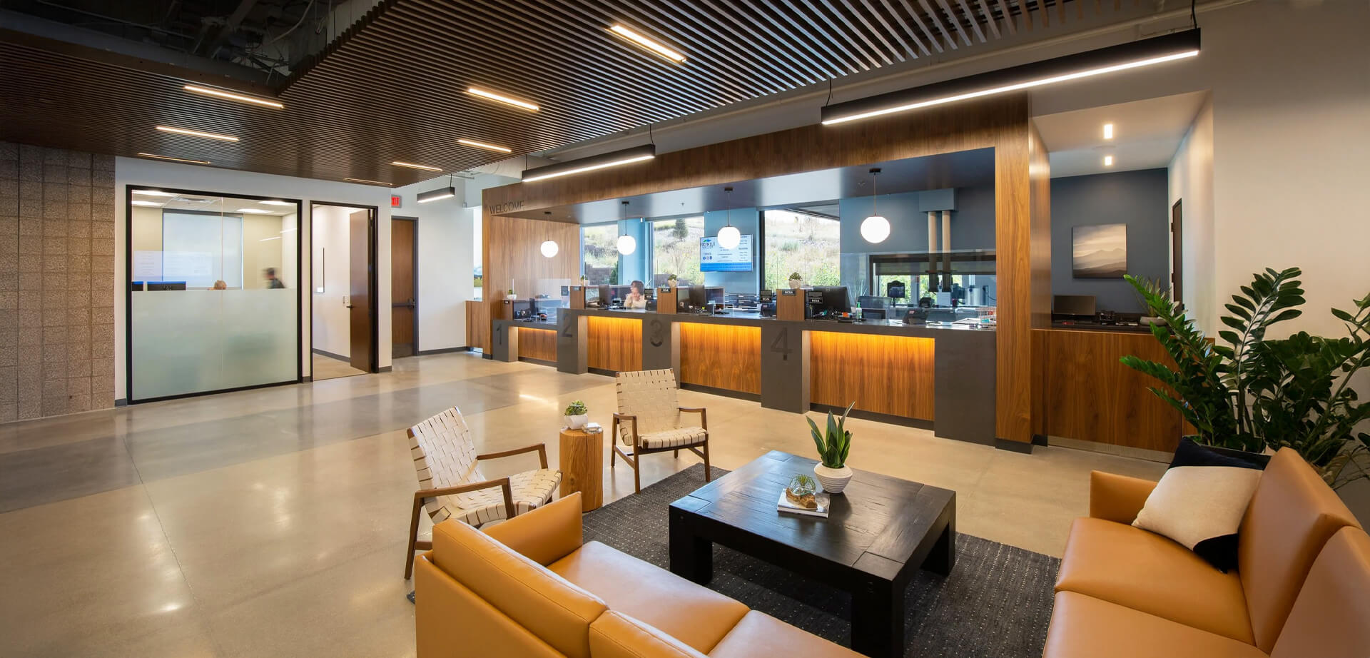 he teller counter of a bright and modern interior of the Carolina Foothills Credit Union branch located in Wheat Ridge, Colorado.