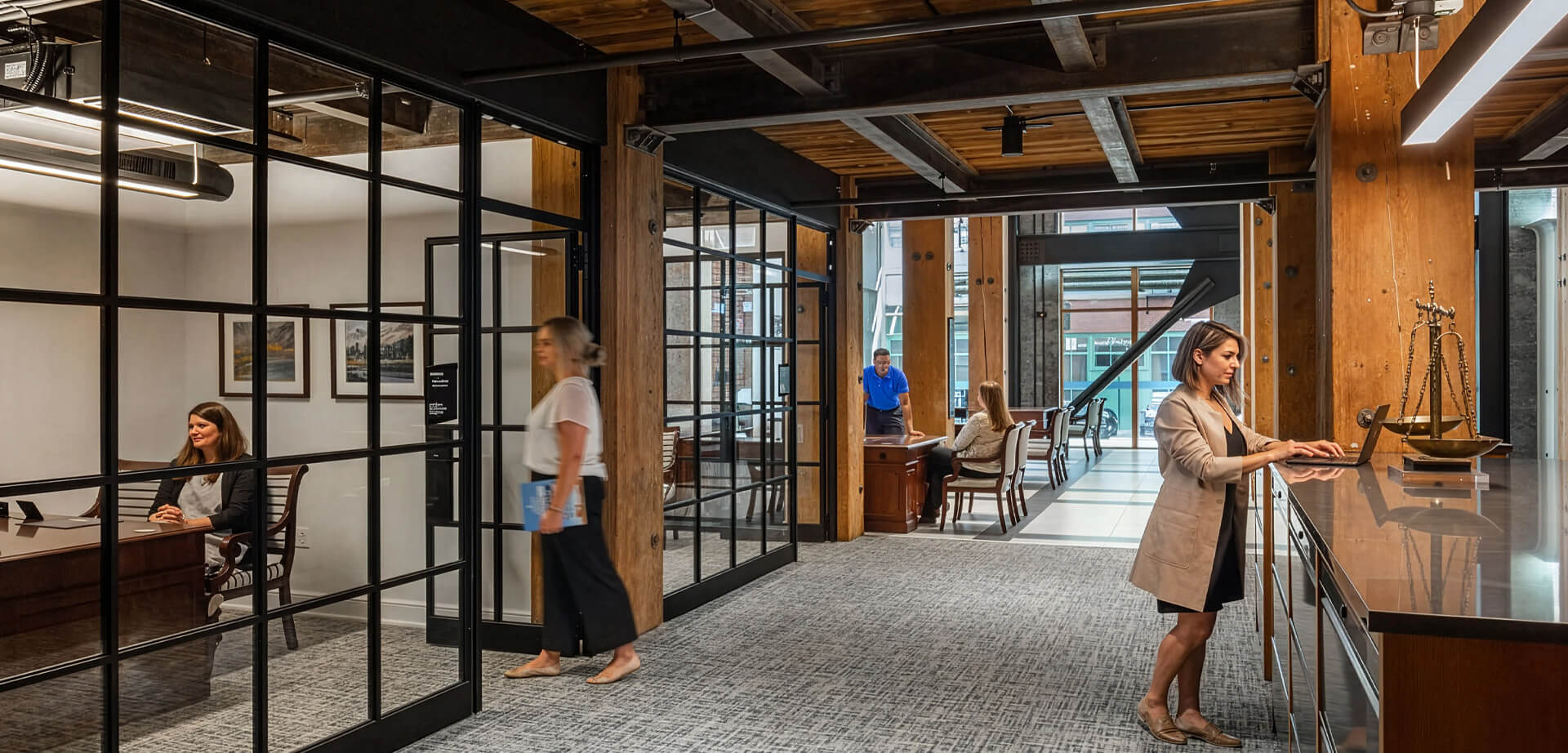 This image features a modern office branch of First Citizens Bank with an industrial design aesthetic.