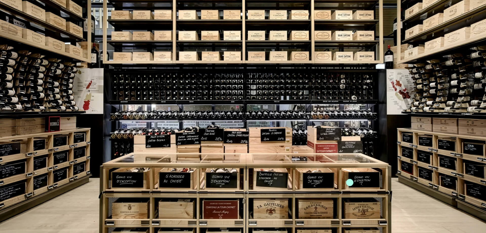 Carrefour features a modular wine department design similar to displays by EuroCave, keeping wine bottles stored horizontally while showcasing the wooden cases.