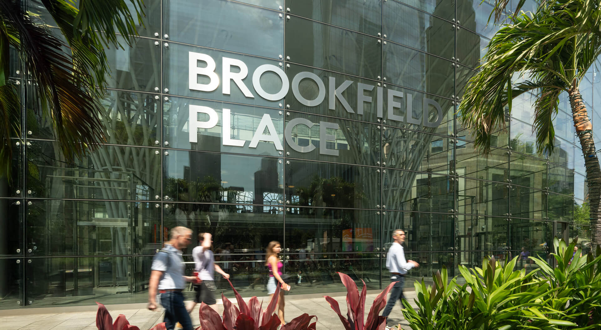 The image shows the exterior glass facade of Brookfield Place, a prominent 14-acre commercial and retail complex located in Lower Manhattan, New York City.
