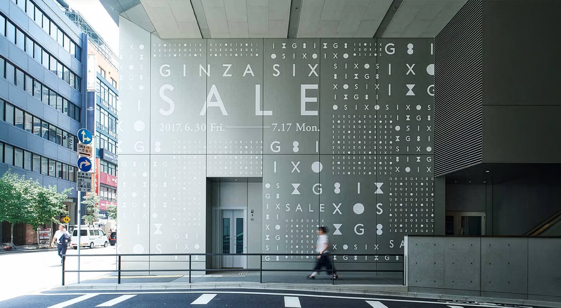 GINZA SIX luxury shopping complex in Tokyo, Japan, featuring a graphic sale display designed around the building's signature monogram.