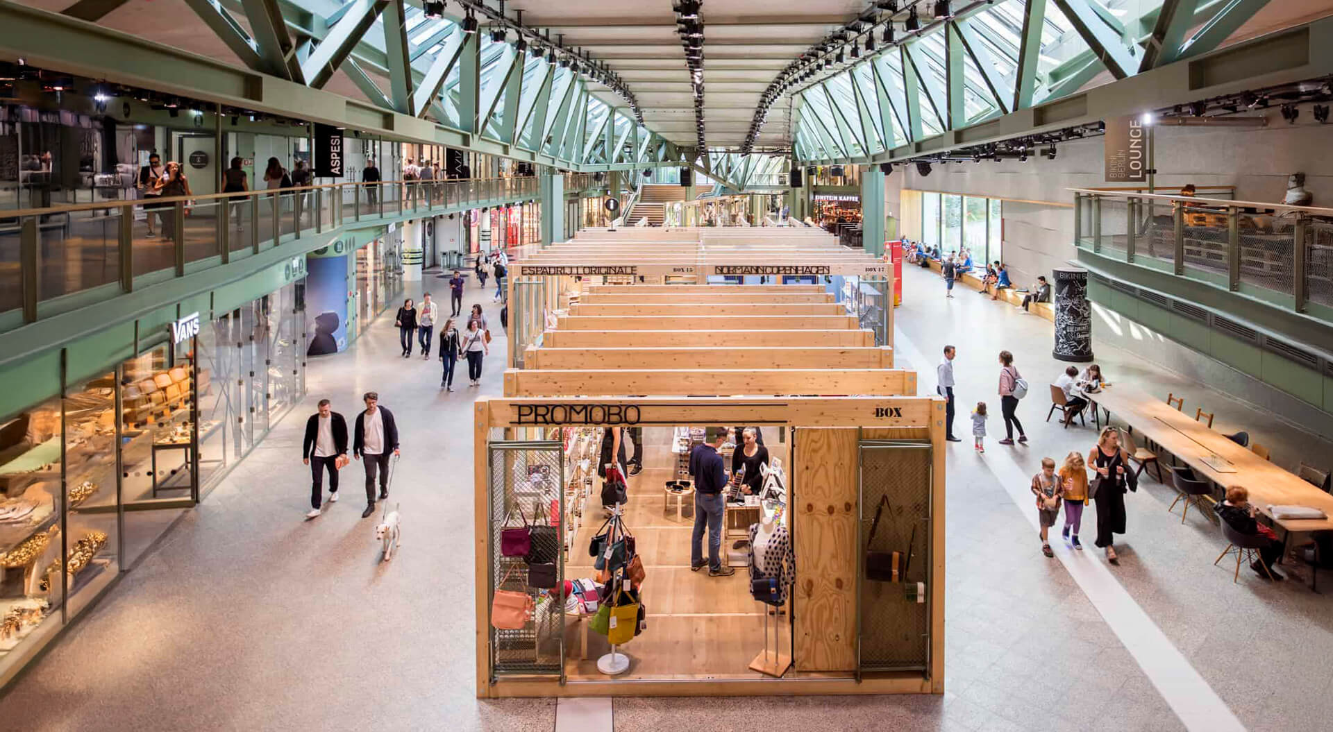 Bikini BerlinMall Pop-Up Boxes: Wooden modular units in the centre of the hall used for rotating retail shops and brands.