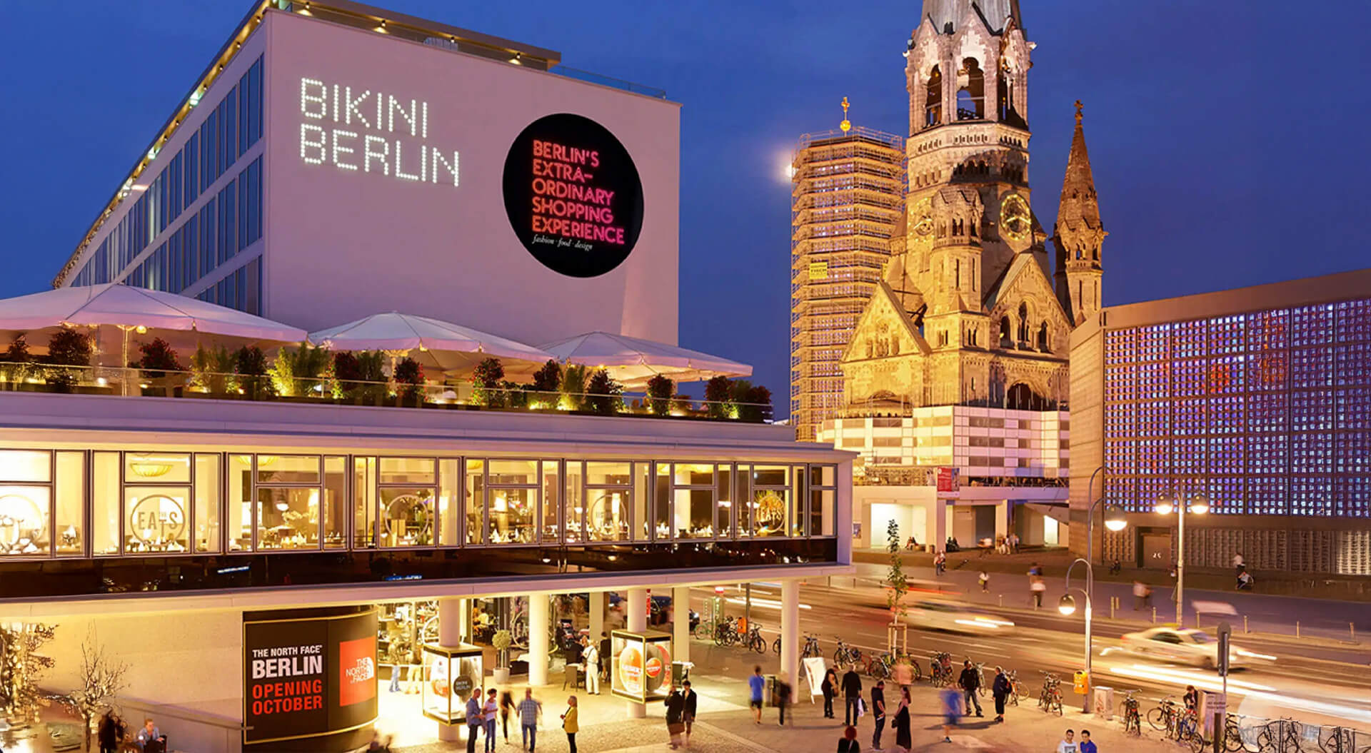 Night view of Bikini Berlin, concept shopping mall alongside the historic Kaiser Wilhelm Memorial Church in Berlin, Germany.