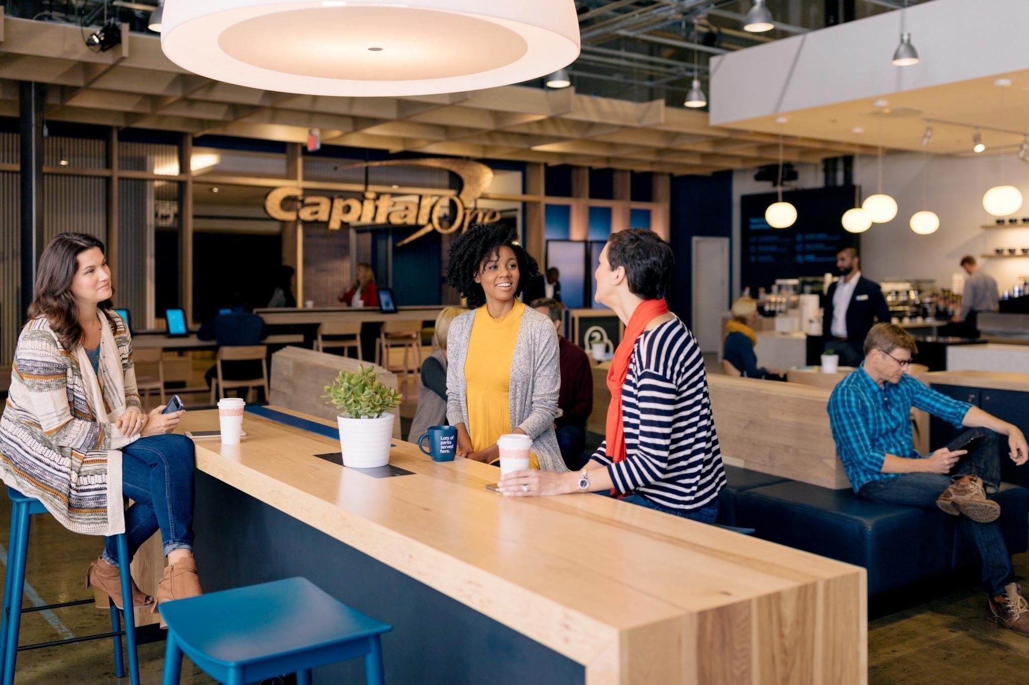 Capital One new experiential strategy bank branch rebrand interior design and innovation lifestyle concepts